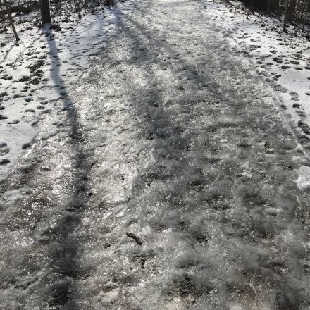 Frozen footsteps on a cinder trail