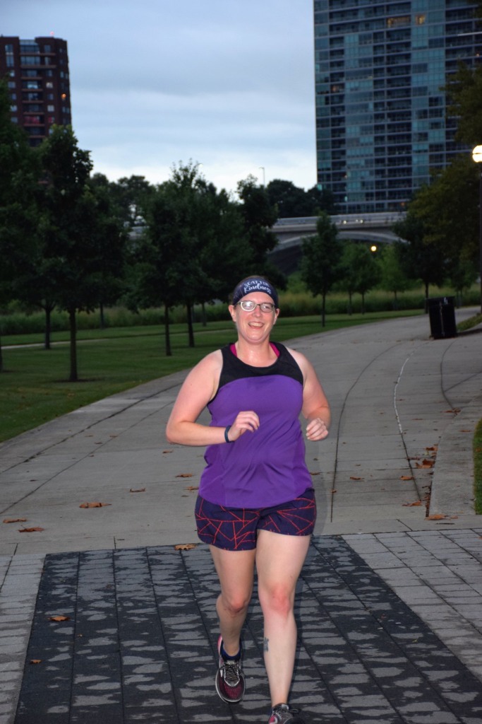 Person in a purple tank top running 